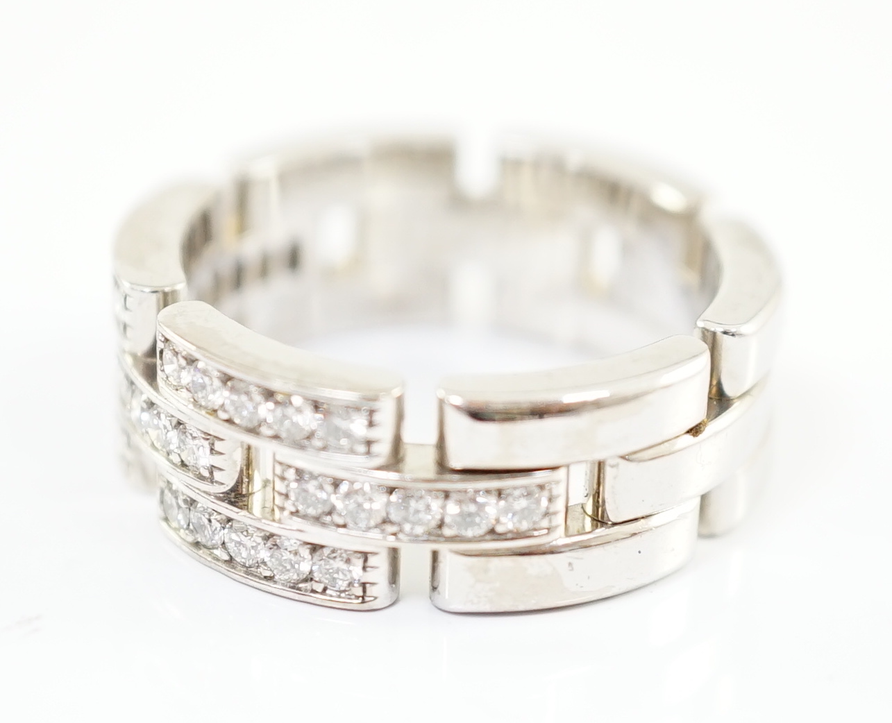 A modern Cartier 18ct white gold and diamond cluster set Panthere Maillon band